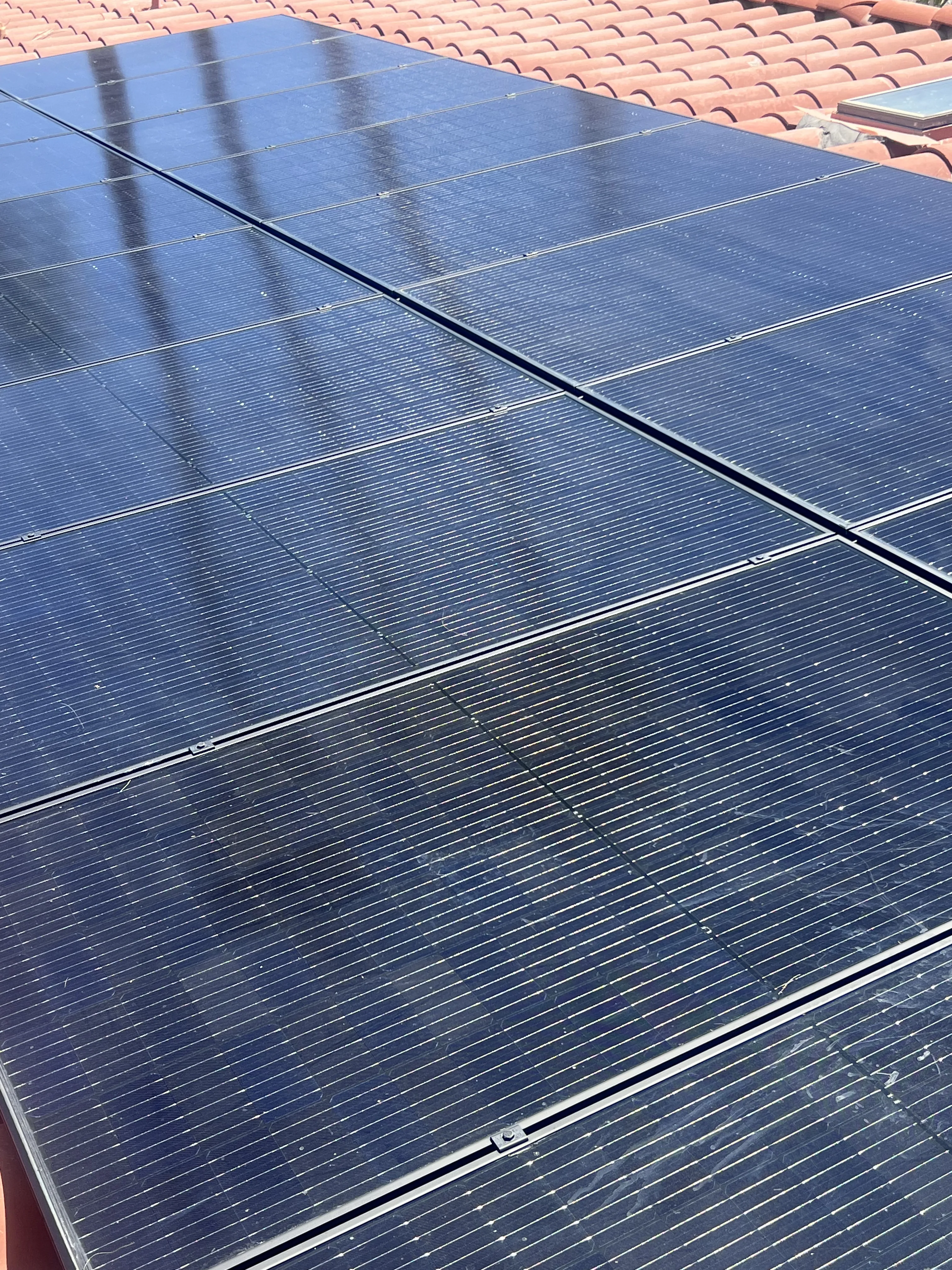Close-up of solar panel glass collecting desert dust
