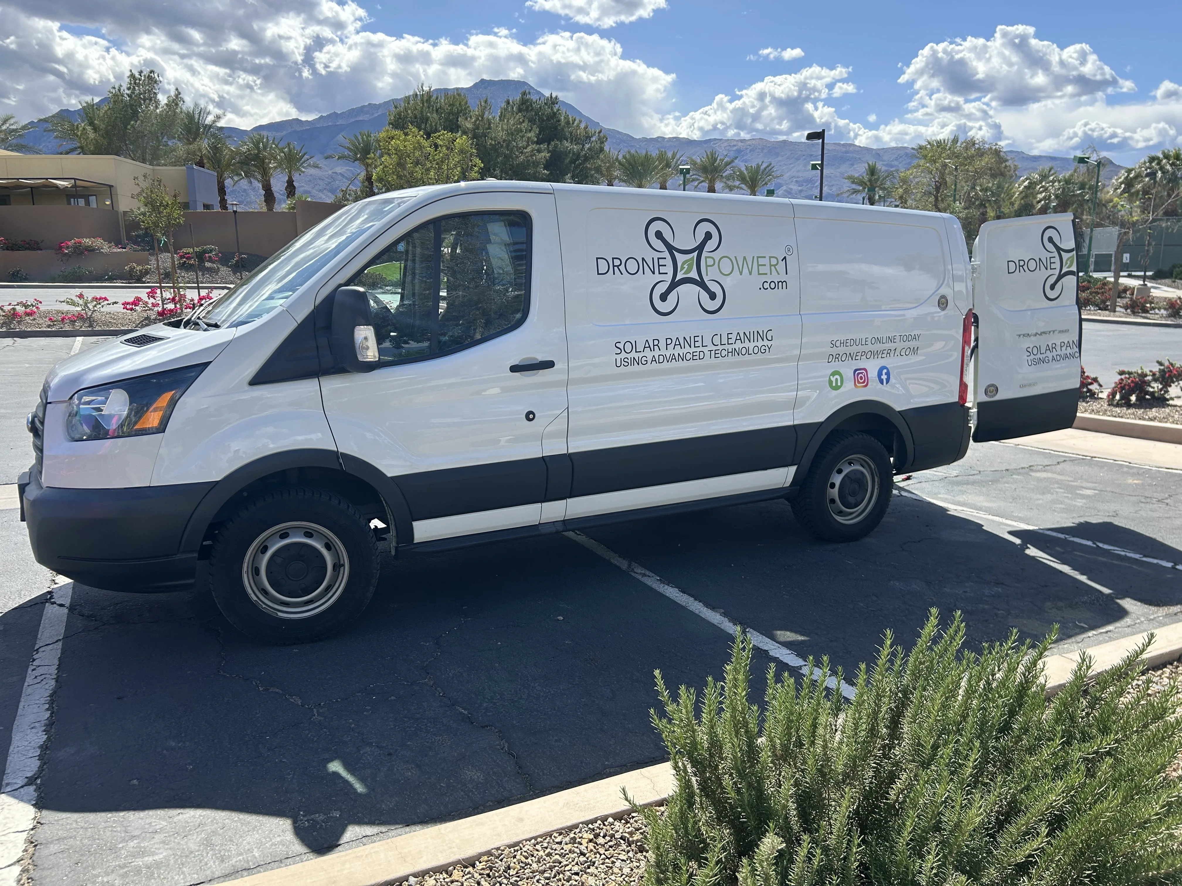 Crew vehicle staged with the desert mountains behind — Coachella Valley local, mobilized and ready.